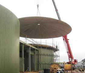 Positioning fibreglass roof onto concrete tank