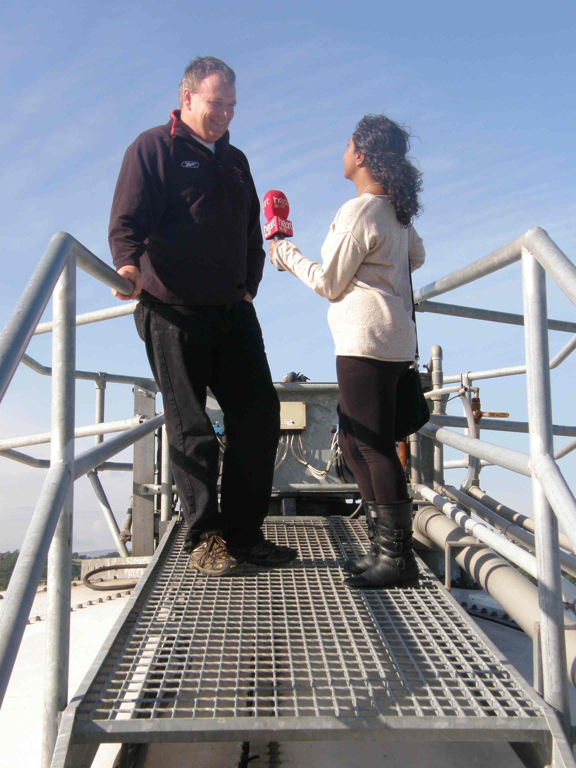 Richard Tomlinson and Charlene Smith on top of the Fre-energy digester at Lodge Farm